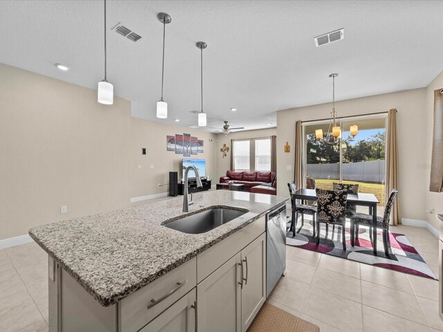 528 Bellissimo Pl, Howey In The Hills, FL 34737 - kitchen featuring a sink, a kitchen island with sink, visible vents, light stone countertops, and dishwasher