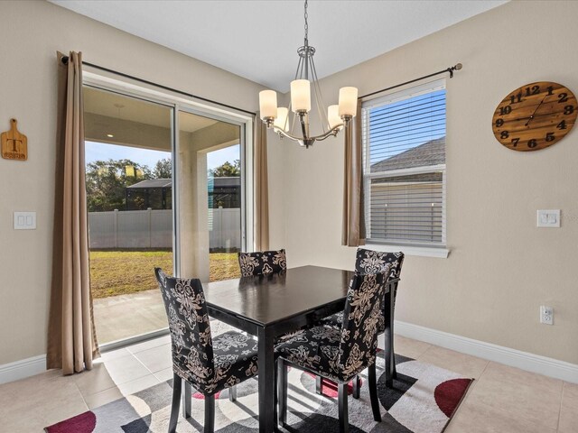 528 Bellissimo Pl, Howey In The Hills, FL 34737 - dining room with a chandelier, baseboards, and light tile patterned floors