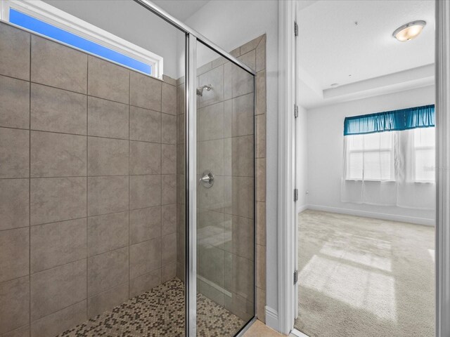 528 Bellissimo Pl, Howey In The Hills, FL 34737 - bathroom featuring baseboards and a shower stall