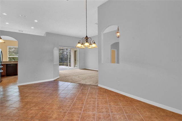 interior space featuring light tile patterned floors and an inviting chandelier