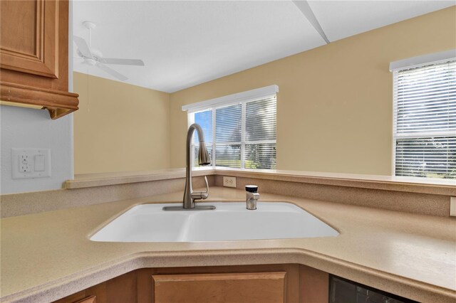 4538 Nottoway Dr, Leesburg, FL 34748 - interior details with light countertops, brown cabinets, a ceiling fan, and a sink