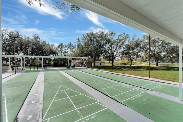 4538 Nottoway Dr, Leesburg, FL 34748 - view of community featuring shuffleboard and a lawn
