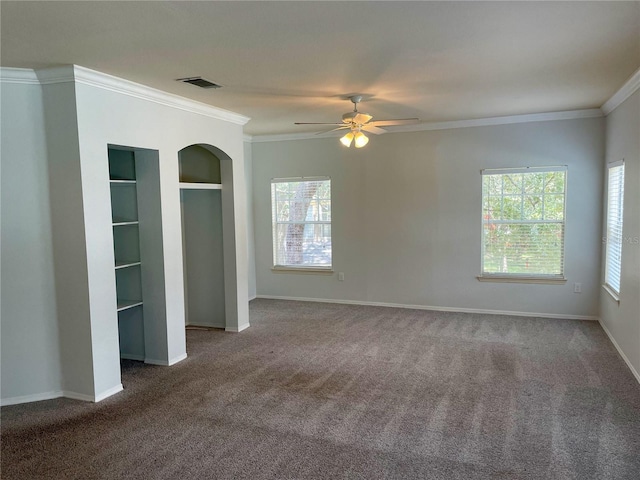 unfurnished bedroom with ceiling fan, carpet, and ornamental molding