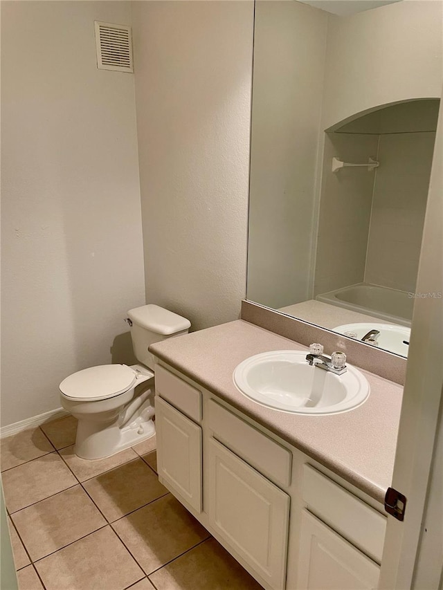 full bathroom featuring vanity, toilet, washtub / shower combination, and tile patterned flooring