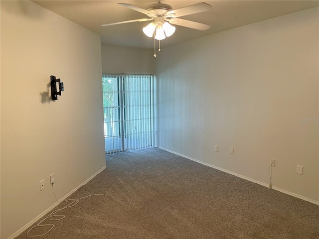 spare room featuring ceiling fan and carpet