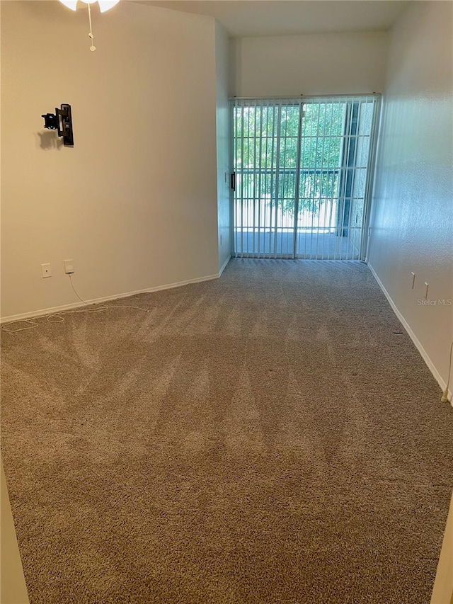 unfurnished room with carpet flooring