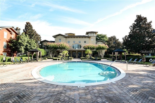 view of pool featuring a gazebo and a patio