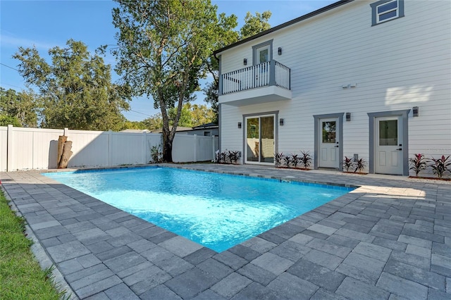 view of pool with a patio and pool water feature