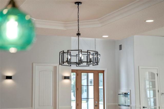 details with ornamental molding and a tray ceiling