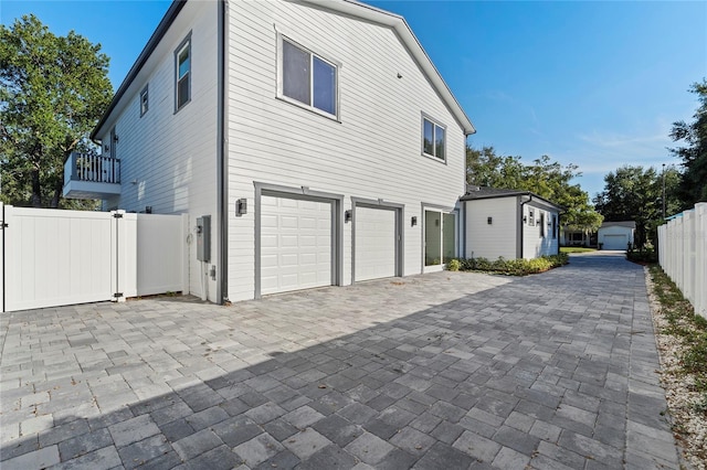 view of side of home with a garage