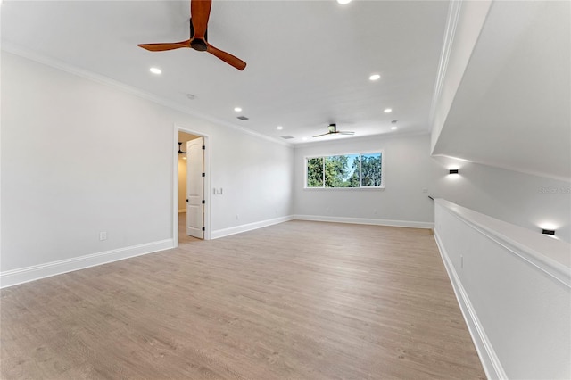 unfurnished room featuring ceiling fan, light hardwood / wood-style flooring, and ornamental molding