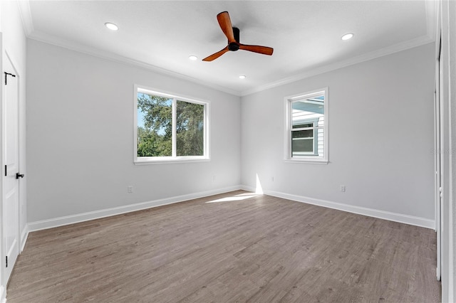 unfurnished room featuring hardwood / wood-style floors, ceiling fan, and ornamental molding