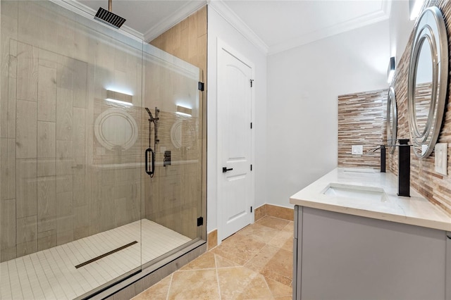 bathroom with vanity, tile patterned flooring, ornamental molding, and a shower with shower door