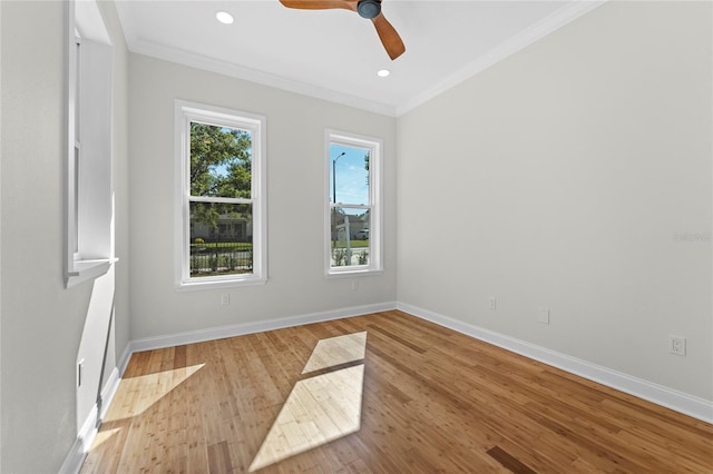 spare room with ceiling fan, light hardwood / wood-style flooring, and crown molding