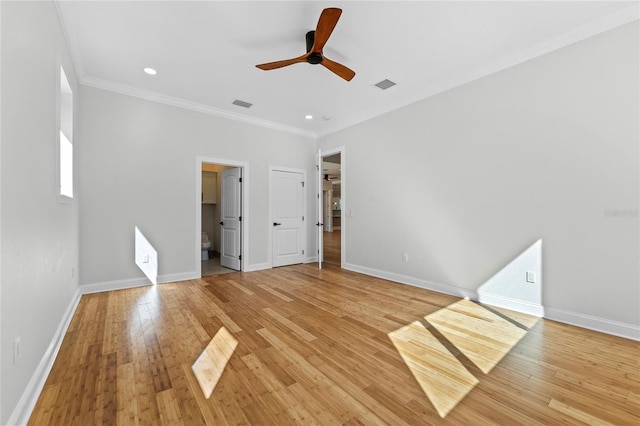 spare room with ornamental molding, light wood-type flooring, and ceiling fan