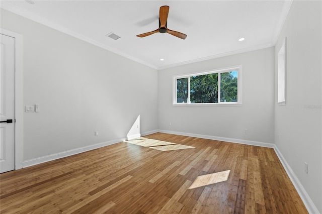 unfurnished room featuring light wood-type flooring, ceiling fan, and crown molding