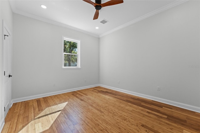 empty room featuring hardwood / wood-style floors, ceiling fan, and crown molding