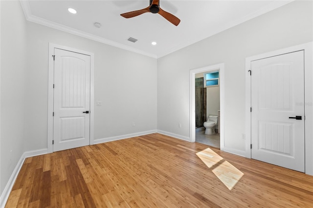 unfurnished bedroom featuring ensuite bathroom, light hardwood / wood-style floors, ceiling fan, and crown molding