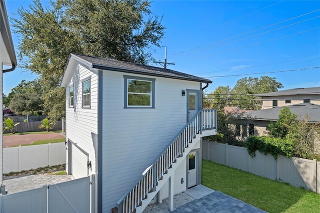 view of home's exterior featuring a patio area and a lawn