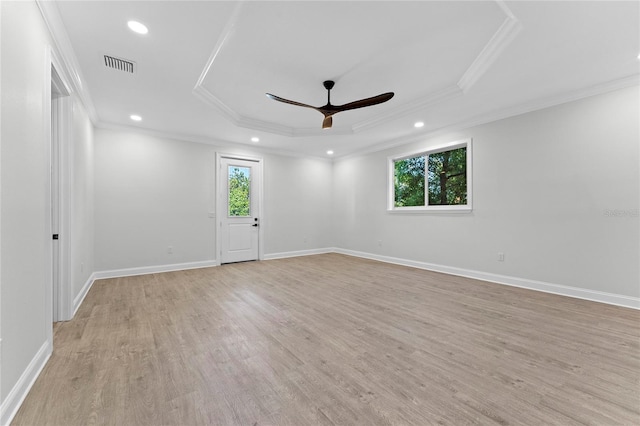 empty room featuring ornamental molding, light hardwood / wood-style flooring, a healthy amount of sunlight, and ceiling fan