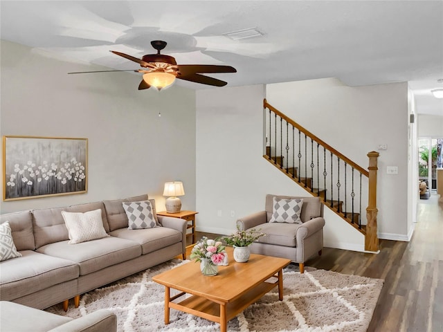 living room with dark hardwood / wood-style floors and ceiling fan