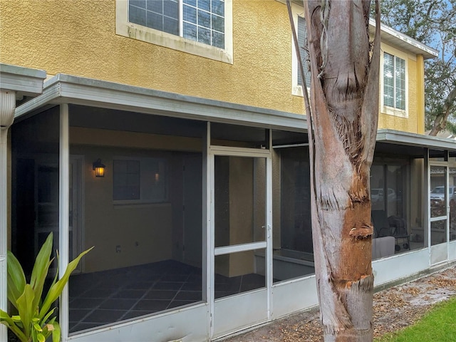 back of house with a sunroom