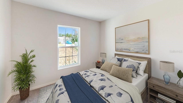 carpeted bedroom featuring a textured ceiling