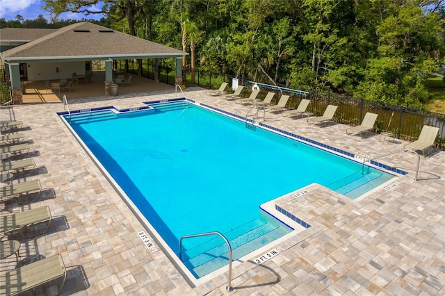 view of swimming pool with a patio