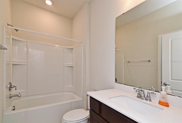 full bathroom with toilet, vanity, and washtub / shower combination