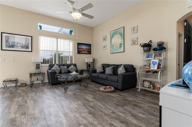 living room with wood-type flooring and ceiling fan