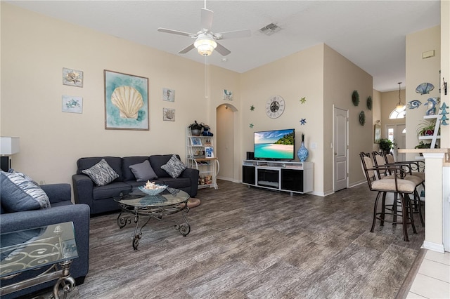 living room featuring hardwood / wood-style floors and ceiling fan