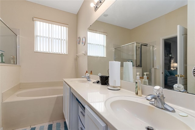 bathroom featuring vanity, shower with separate bathtub, and tile patterned flooring