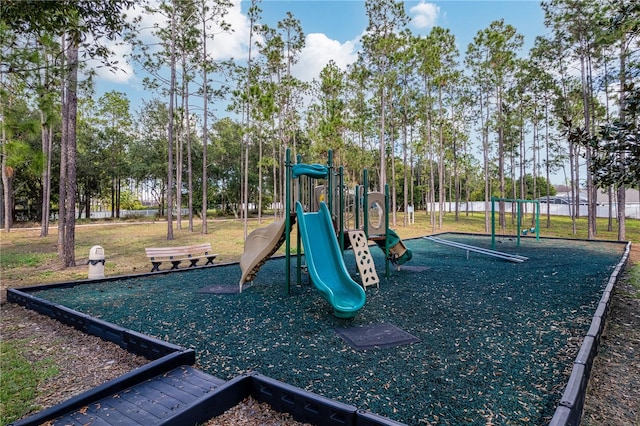 view of jungle gym with a lawn