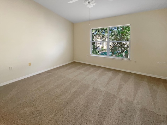 carpeted empty room with ceiling fan