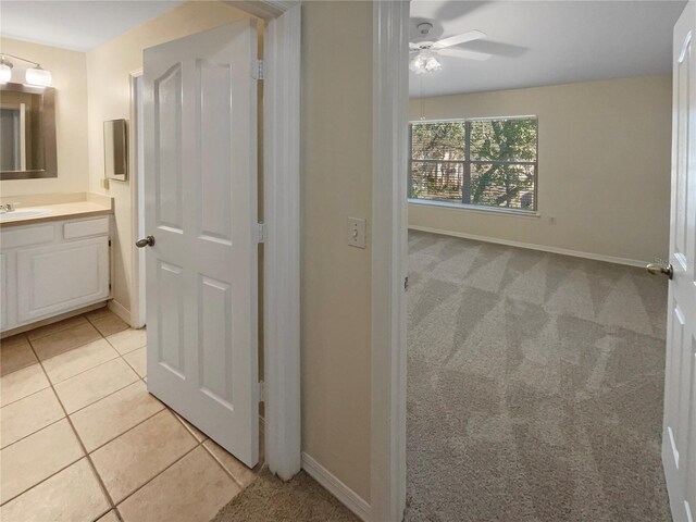 1711 Shadow View Cir Unit 1711, Maitland, FL 32751 - bathroom with vanity, a ceiling fan, baseboards, and tile patterned floors