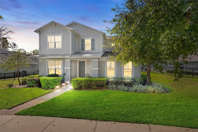 view of front of house with a lawn