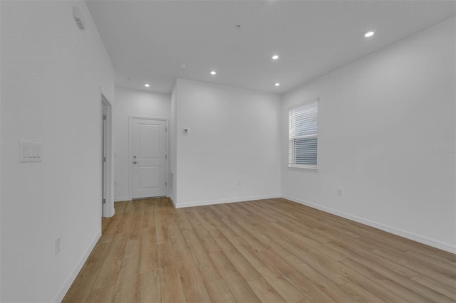 unfurnished room featuring light wood-type flooring