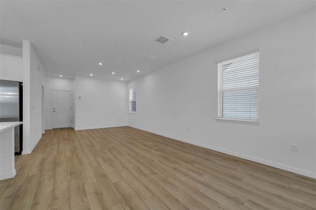 unfurnished living room featuring light hardwood / wood-style flooring