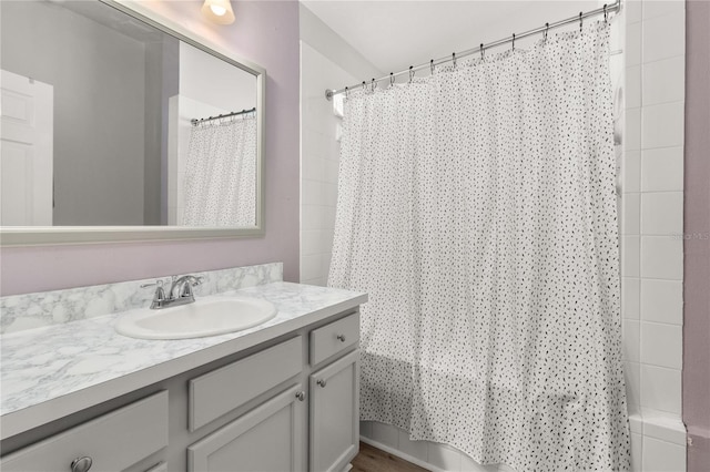 bathroom with vanity and shower / tub combo