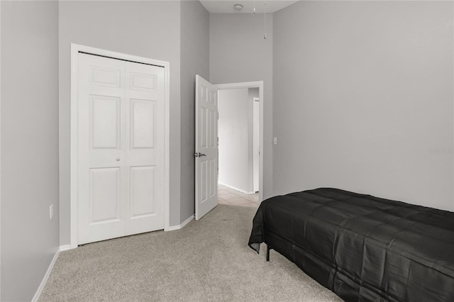 carpeted bedroom with a closet