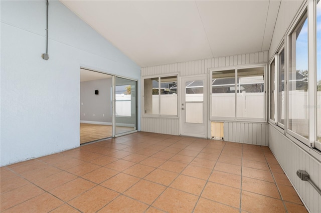 unfurnished sunroom with lofted ceiling