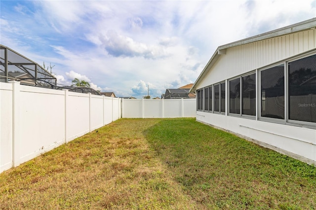 view of yard with a sunroom