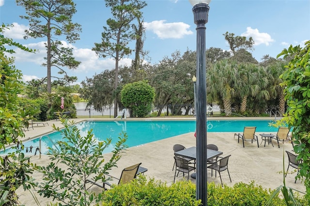 view of swimming pool featuring a patio area