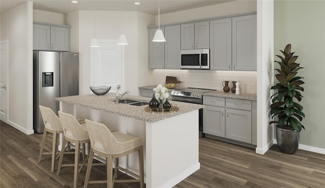 kitchen featuring gray cabinetry, sink, stainless steel appliances, tasteful backsplash, and pendant lighting