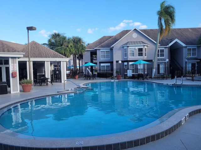 view of swimming pool featuring a patio