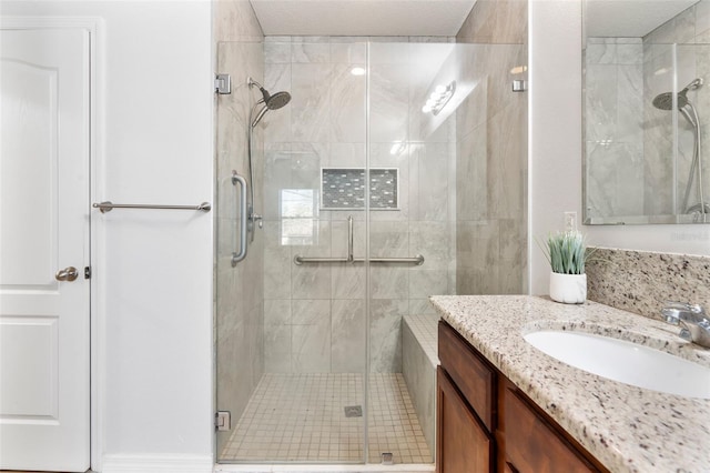 bathroom with vanity and an enclosed shower