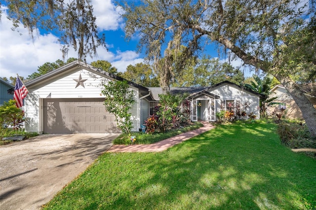 ranch-style house featuring a front lawn and a garage