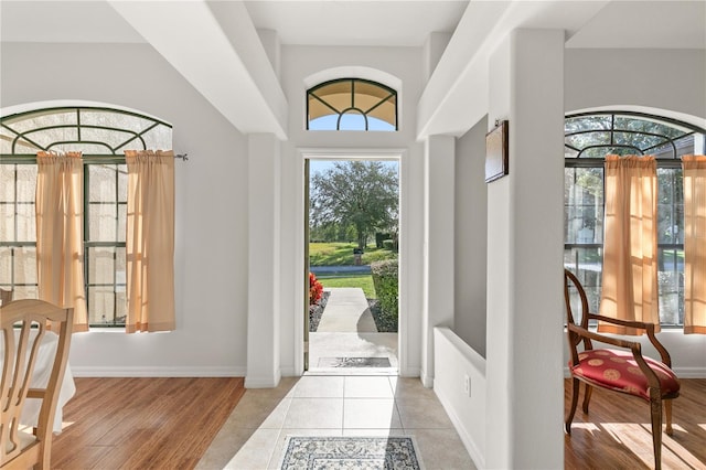 foyer featuring light wood-type flooring and baseboards