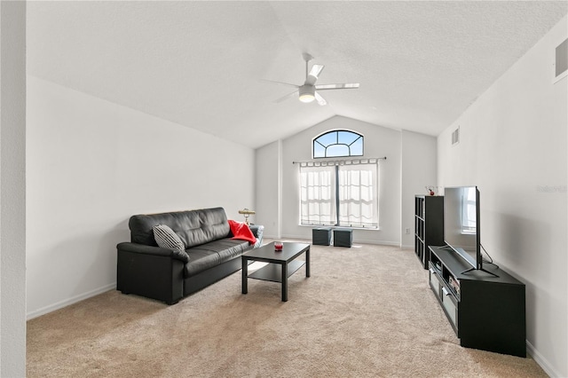 living room with visible vents, a ceiling fan, light colored carpet, lofted ceiling, and a textured ceiling