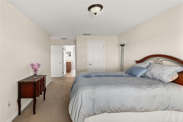 bedroom featuring light carpet, baseboards, and visible vents